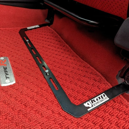 KAP fire extinguisher bracket bolted to the front seat rails of a Honda Civic Type R, shown before the extinguisher is fitted