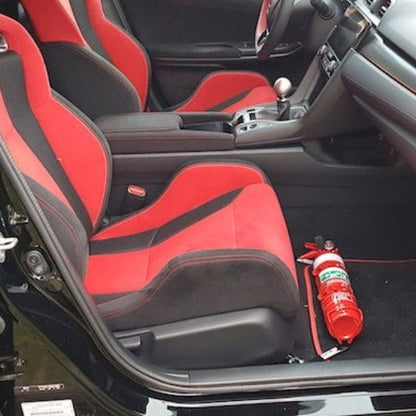 Honda Civic Type R cabin with a red fire extinguisher mounted on a KAP bracket at the base of the front seat