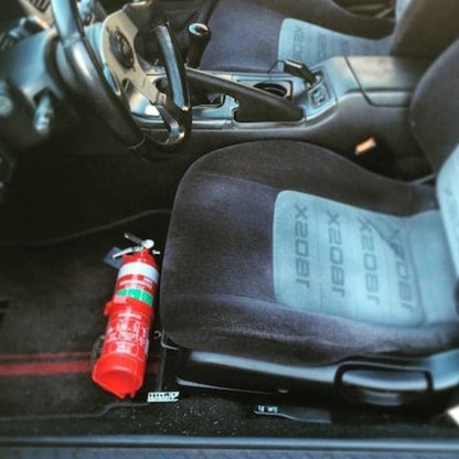 RAM RAM 2500/3500 cabin with a red fire extinguisher mounted on a KAP bracket at the base of the front seat