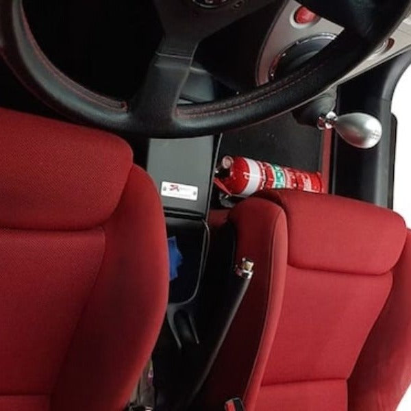 Honda Civic Type R cabin with a red fire extinguisher mounted on a KAP bracket at the base of the front seat