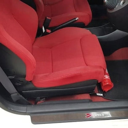 Honda Civic Type R cabin with a red fire extinguisher mounted on a KAP bracket at the base of the front seat
