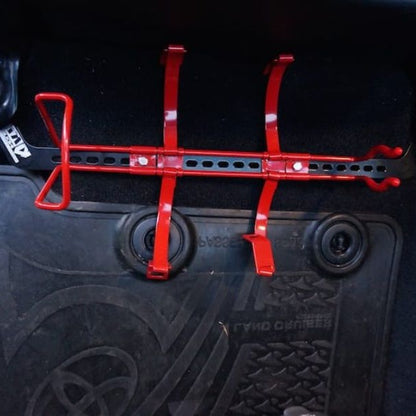 KAP bracket bolted to the front seat rails of a Toyota LandCruiser 200 Series, before the extinguisher is fitted